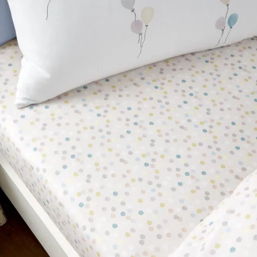 This Brushed Balloons Toddler Fitted Sheet is made by Little Bianca from 100% Cotton, featuring multi-coloured confetti spots.