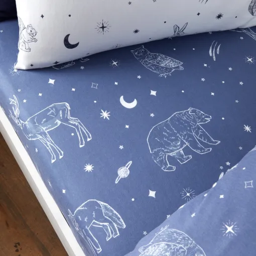 This Brushed Starlight Animals Fitted Sheet is made by Little Bianca from 100% Cotton, featuring hand-drawn animals set against a deep blue background.