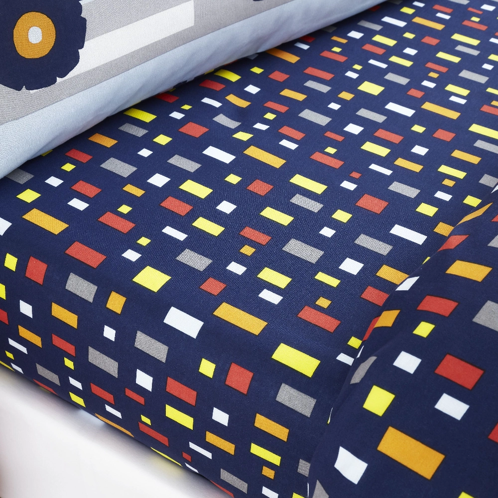 Construction Fitted Sheet by Catherine Lansfield in navy, with pops of primary colours, playful geometric shapes, a great addition to any kids room.