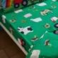 Farmyard Fitted Sheets by Catherine Lansfield featuring wonderful farm animals on a green background, will help to complete your farmyard themed room