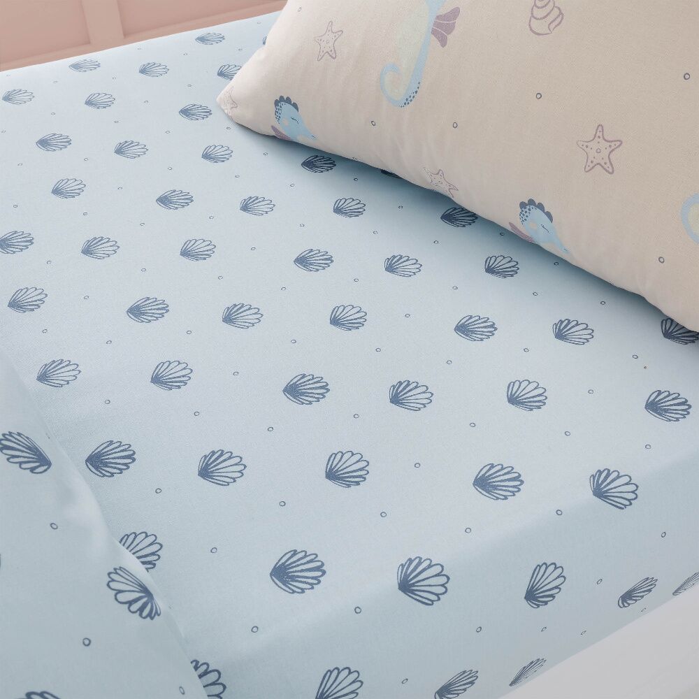 Seahorse Toddler Fitted Sheet by Chapter B will help to complete the calming aquatic look, with this soft Polycotton sheet in a soft blue adorned with sea shells.