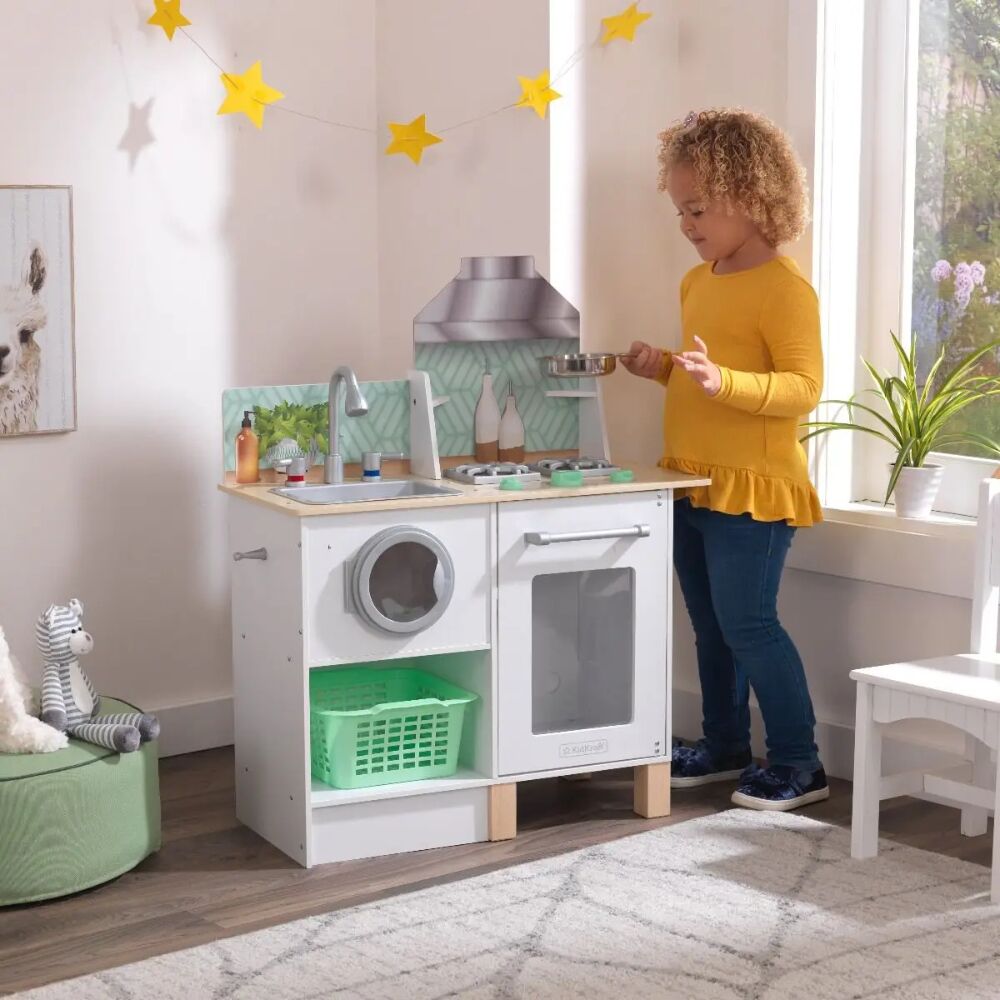Kidkraft Whisk & Wash Kitchen Laundry is a 2 in 1 playset, complete with a sink, washer, oven, stove and vent for lots of hands-on imaginative play. Kids can cook and wash clothes simultaneously.