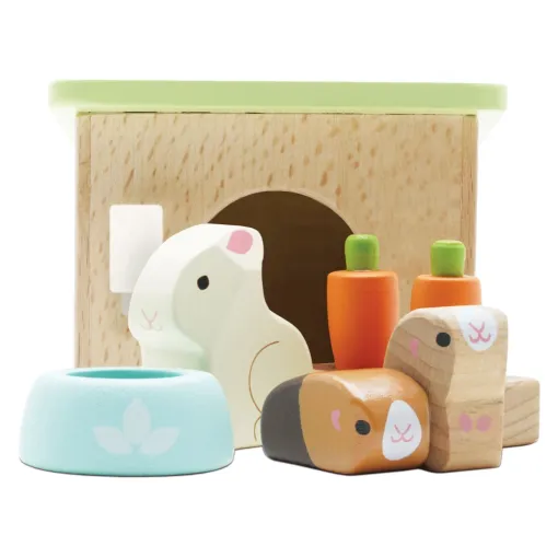 Le Toy Van Bunny & Guinea Playset consists of a Hutch with a Bunny, a Guinea Pig, a feeding bowl, some carrots, perfect for any Le Toy Van Dolls Houses.