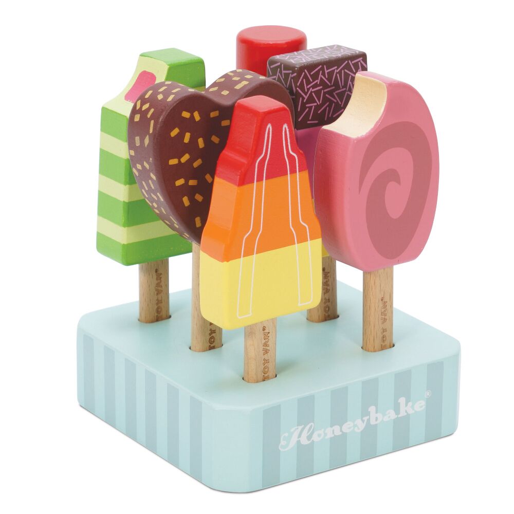 Le Toy Van Ice Lolly Set of six, hand painted, ice-lollies and popsicles, comes complete with a sturdy wooden base and is a wonderful toy to assist with co-ordination and refine fine motor skills as well as encourage creative play.