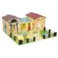 Le Toy Van Farmyard features a large barn with hay loft, milking parlour, farm house, pigsty laid out on a baseboard surrounded with fences.