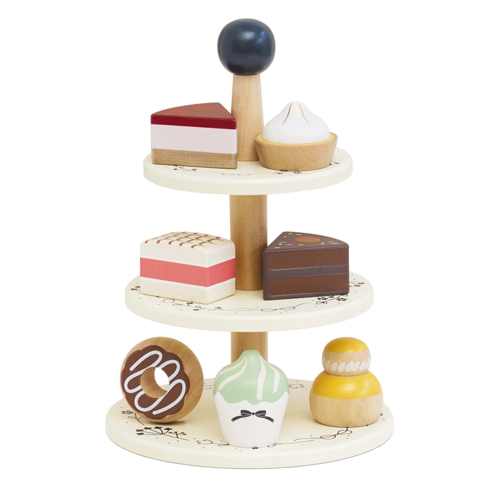 Le Toy Van Three Tier Patisserie Cake Stand, is a beautiful wooden toy, with a selection of 7 delectably sweet treats, perfect for any occasion!