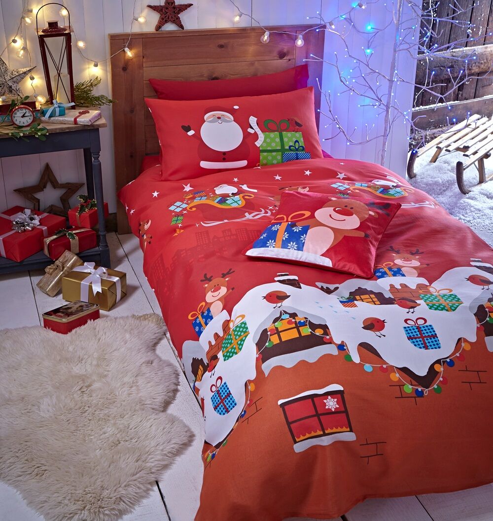 Santa's Christmas Presents Single Duvet Set features Santa on his sleigh as he flies through a starry night distributing all his presents.