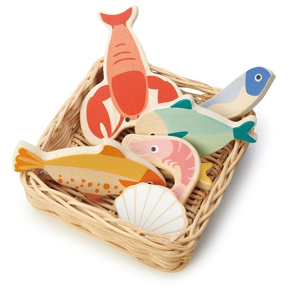 This Tender Leaf Toys Seafood Basket is a hand crafted plastic-free wicker basket with wooden lobster, plaice, mackerel, herring, whitebait, prawn and scallops.
