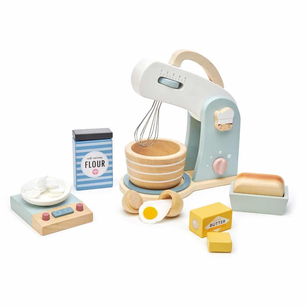 Tenderleaf Toys Home Baking Set is a stylish food mixer, wooden playset with metal swivel whisk, wooden bowl, and clacking on and off button.