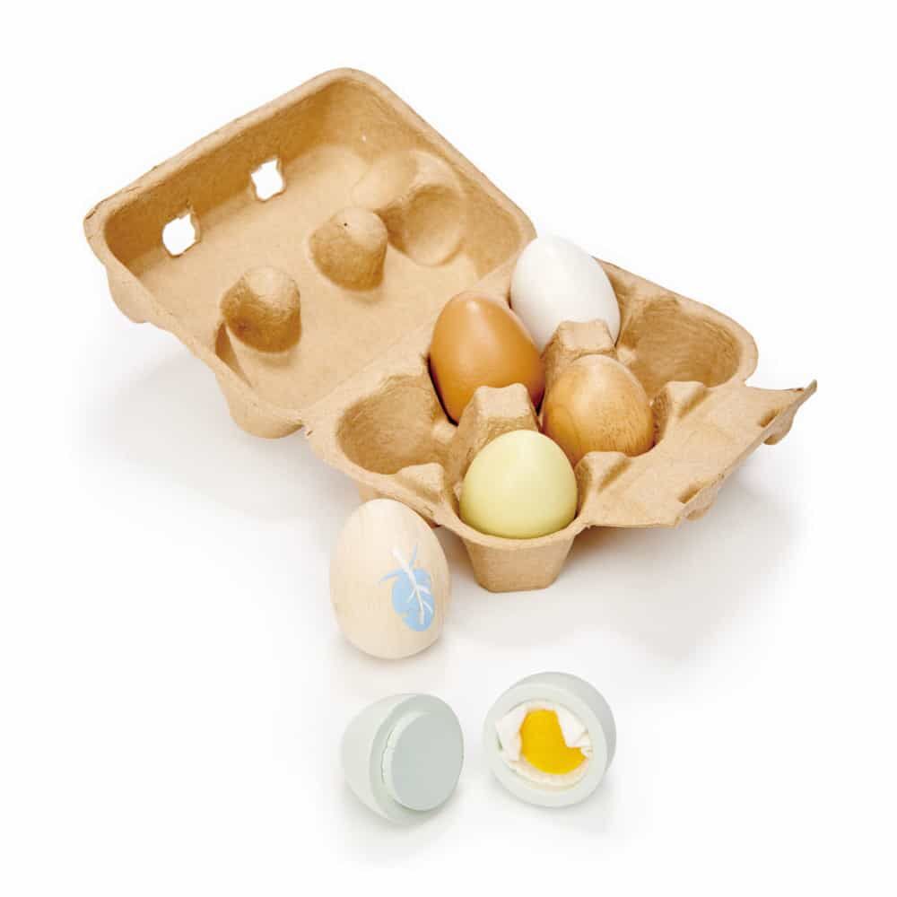 Tenderleaf Toys Wooden Eggs are a realistic egg box that contains 6 solid wood eggs. 3 natural wood, and 3 are painted