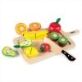 Tidlo Cutting Fruit Set features, chunky wooden cutting fruits, ideal for pretend play, including, a banana, orange, pear, lemon, kiwi and more! all laid out on a chopping board.